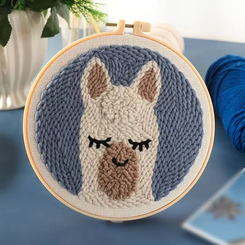 Alpaca Wall Art Punch Needle Kit for Beginners Alpaca wall art punch needle kit showing cute white alpaca design in embroidery hoop with yarn and crafting tools