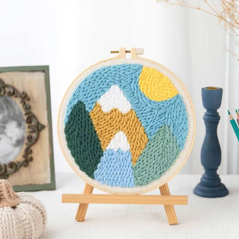 Punch Needle Pastel Mountain Landscape Kit for Beginners Punch needle embroidery kit showing pastel mountain design in hoop frame with yarn and tools for beginners