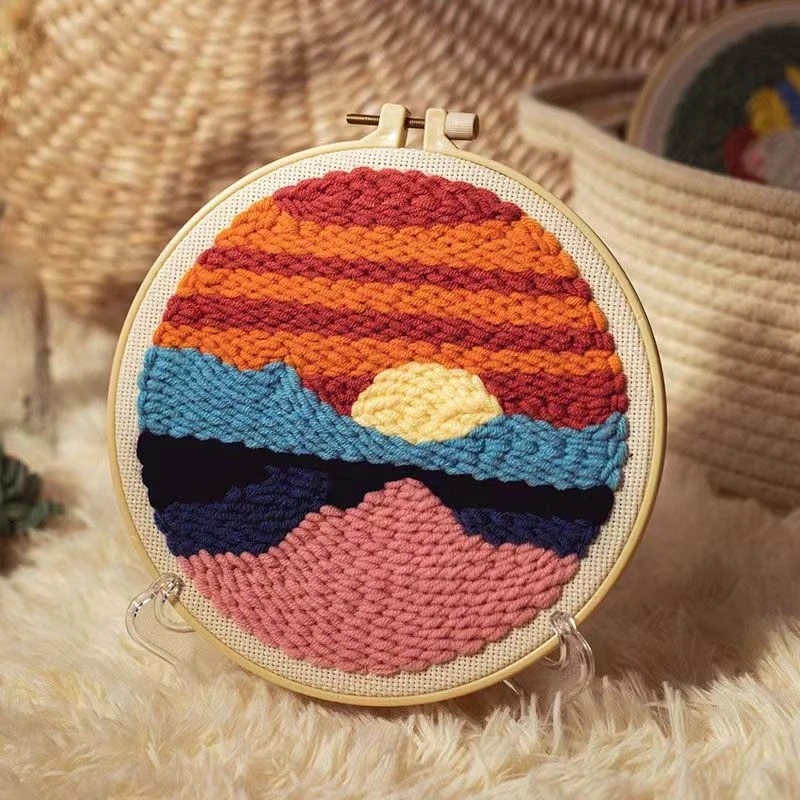 Sunset Art Punch Needle Kit for Beginners Sunset art punch needle embroidery kit with colorful gradient design in wooden hoop, yarn, and beginner supplies
