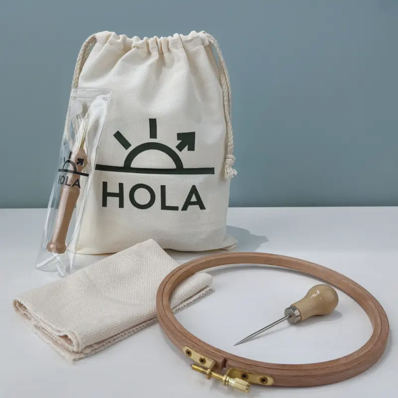 Punch Needle Hoop Kit - Embroidery Hoop, Needle Tool & Fabric Supplies Punch needle hoop kit contents showing wooden embroidery hoop needle tool fabric and branded storage bag