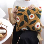 Brown Floral Needle Punch Pillow Kit | Vibrant Home Decor Handcrafted needle punch pillow with colorful floral pattern on wooden chair, showing textured rose design perfect for home decor
