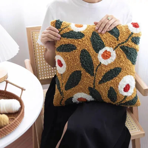 Brown Floral Needle Punch Pillow Kit | Vibrant Home Decor Handcrafted needle punch pillow with colorful floral pattern on wooden chair, showing textured rose design perfect for home decor