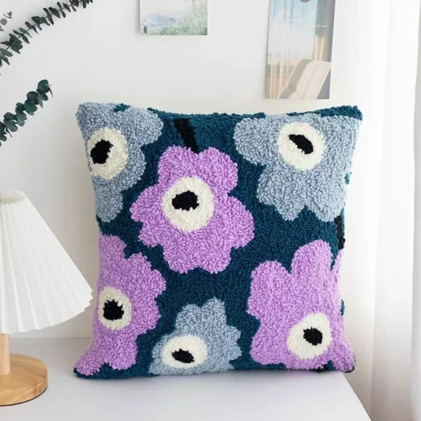 Purple Flowers Punch Needle Pillow Kit Purple flowers punch needle pillow kit showing finished cushion with floral design and crafting materials
