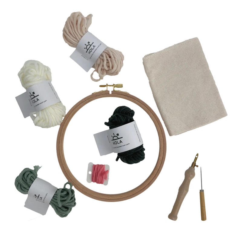 Complete punch needle starter kit with colorful yarn bundles, wooden hoop, fabric, and punch needle tool for beginners