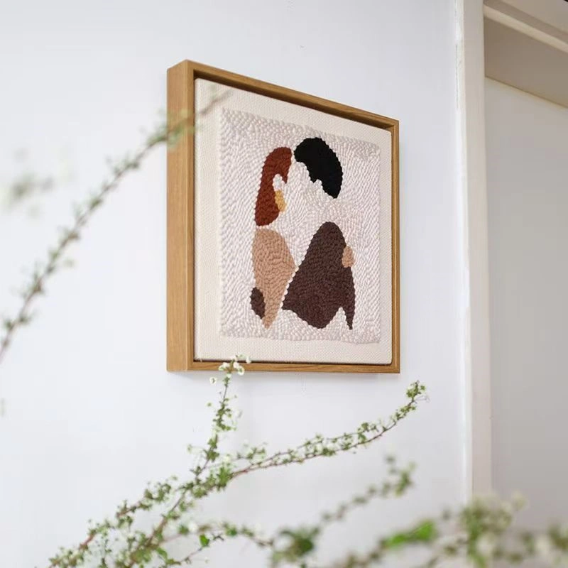 DIY Couple Gift Abstract Punch Needle Art Framed Wall Decor Close-up of DIY couple gift framed punch needle art showing brown and black abstract couple figures on textured fabric