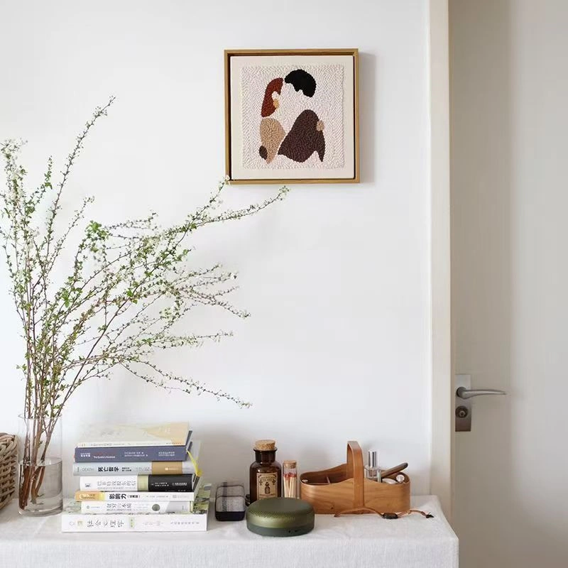 DIY Couple Gift Punch Needle Wall Art Modern Home Styling DIY couple gift punch needle wall art hung above desk with books and plants in minimalist modern room decor