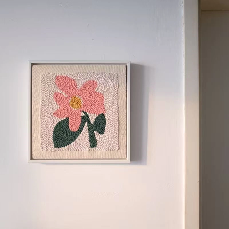 DIY Framed Flower Punch Needle Embroidery Kit DIY flower embroidery wall art framed and hung, featuring soft pink petals and green leaves