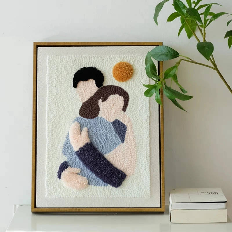 Punch Needle Hug Art – DIY Wall Embroidery Kit Punch needle hug art design featuring two figures embracing, framed as warm DIY wall decor or a sentimental handmade gift