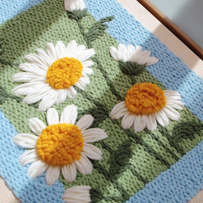 Textured Daisy Wall Art Close-up — A Sunlit Touch of Handmade Beauty Close-up of punch needle daisy wall art in sunlight, showing vibrant texture and handmade detail.