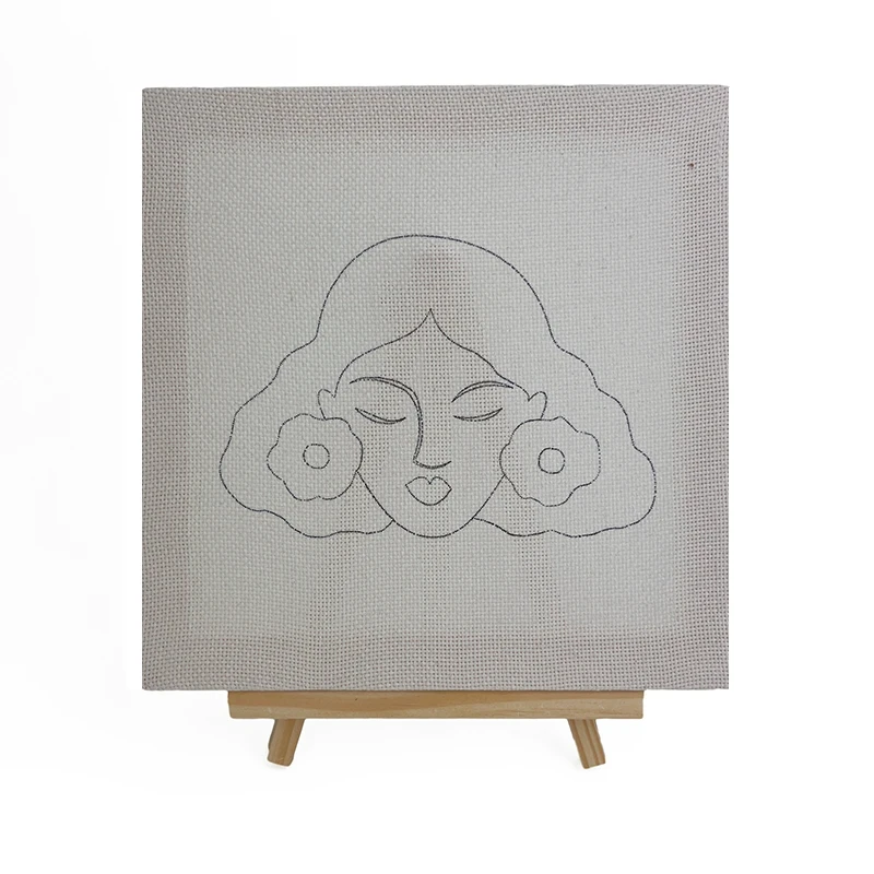 Frida Kahlo Wall Art Pattern - Punch Needle Embroidery Design Frida Kahlo wall art pattern drawn on fabric for punch needle embroidery, featuring iconic portrait with flowers on easel