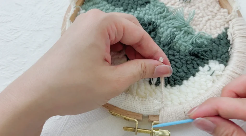 Stitching around the hoop while leaving the screw closure area unfinished.