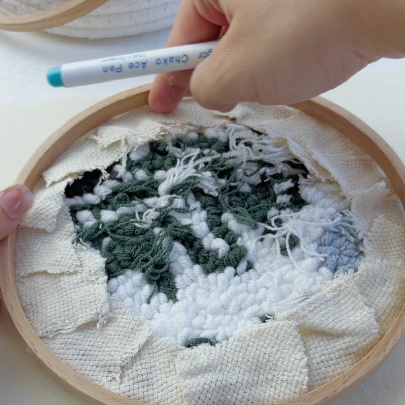 Measuring the embroidery size using the inner hoop ring.