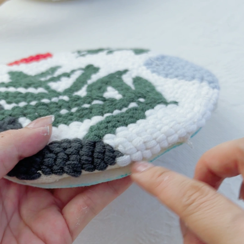 Felt backing extending slightly beyond the embroidery edge.