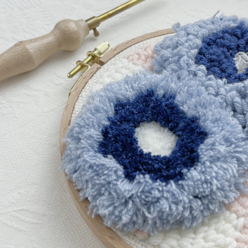 Demonstrating loop height differences created by varying punch needle lengths.