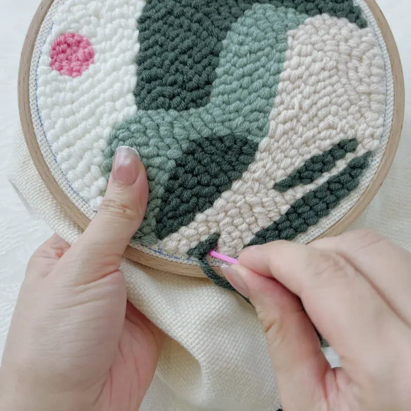 Refining edges and small areas using a tapestry needle.