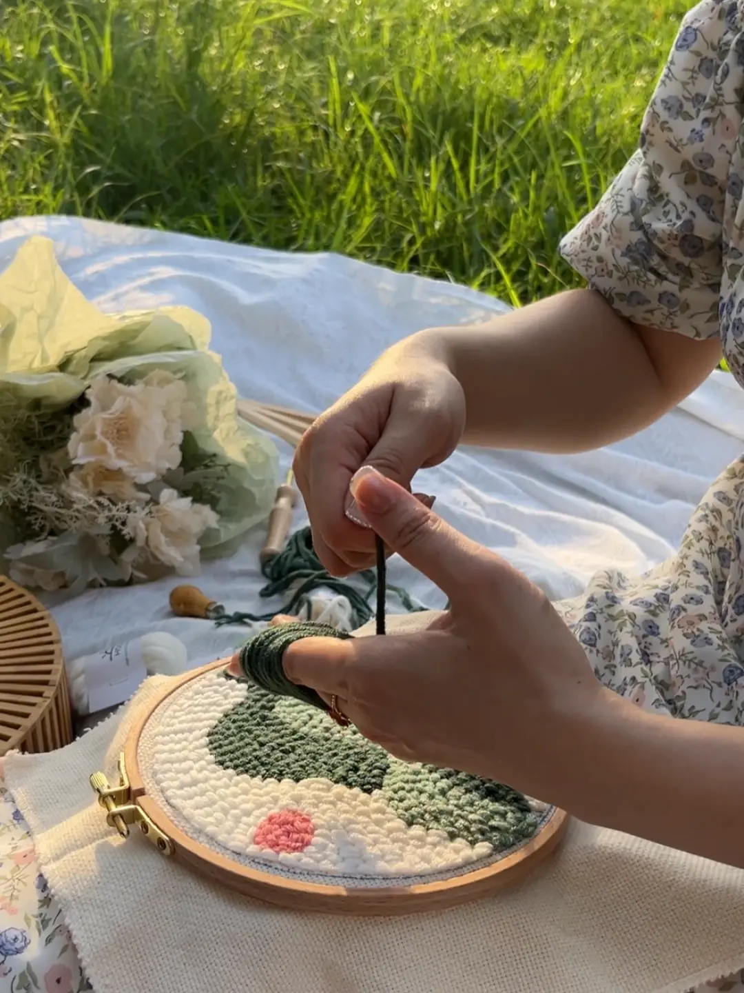 Finished HolaKits punch needle wall decor in sunset light.